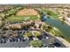 Aerial view of golf course clubhouse, green and practice range, and the surrounding mature landscaping at 8629 Prairie Hill Dr, Las Vegas, NV 89134