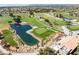 Golf course view showcasing the water feature, green, and mature palm trees on the community grounds at 8629 Prairie Hill Dr, Las Vegas, NV 89134