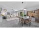 Open-concept living space with modern decor, dining area, and backyard views at 8629 Prairie Hill Dr, Las Vegas, NV 89134