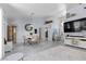 Open-concept living area with dining space, large TV, and stylish decor, creating a comfortable atmosphere at 8629 Prairie Hill Dr, Las Vegas, NV 89134
