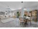 Open-concept living space with modern decor, dining area, and access to the backyard at 8629 Prairie Hill Dr, Las Vegas, NV 89134