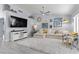 Spacious living room with bright white rug, comfortable sofa, and large television at 8629 Prairie Hill Dr, Las Vegas, NV 89134