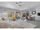 Inviting living room with backyard view, adjacent dining area, and light gray wood flooring at 8629 Prairie Hill Dr, Las Vegas, NV 89134