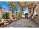 Covered patio with barbecue grill, seating area, and garden views at 8629 Prairie Hill Dr, Las Vegas, NV 89134