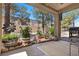 Covered patio with barbecue grill, seating area, and garden views at 8629 Prairie Hill Dr, Las Vegas, NV 89134