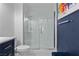 Contemporary bathroom featuring a glass-enclosed shower with white subway tile and modern fixtures at 8629 Prairie Hill Dr, Las Vegas, NV 89134