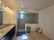 Large bathroom featuring granite counters, a spacious walk-in shower, and neutral decor at 8665 Jerlyn St, Las Vegas, NV 89113