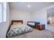Cozy bedroom with a floral-patterned bed, trundle bed, and wood nightstand near a window at 8665 Jerlyn St, Las Vegas, NV 89113