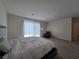 Comfortable main bedroom with soft carpet, natural light, and a relaxing ambiance at 8665 Jerlyn St, Las Vegas, NV 89113