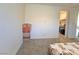 This bedroom has neutral walls, carpet, and a walk-in closet through the open door at 8665 Jerlyn St, Las Vegas, NV 89113