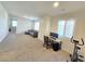 Bright bonus room with plush carpet, comfortable seating and a dedicated workspace at 8665 Jerlyn St, Las Vegas, NV 89113