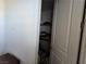 View of closet with hanging clothes and storage on upper shelf at 8665 Jerlyn St, Las Vegas, NV 89113