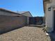 Private side yard with gravel, block wall and metal gate for enhanced security and privacy at 8665 Jerlyn St, Las Vegas, NV 89113