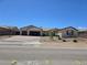 Charming single-story home featuring a three-car garage and low-maintenance desert landscaping at 8665 Jerlyn St, Las Vegas, NV 89113