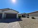 Charming single-story home featuring a three-car garage and low-maintenance desert landscaping at 8665 Jerlyn St, Las Vegas, NV 89113