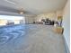 Spacious three car garage with ample lighting and an open overhead door at 8665 Jerlyn St, Las Vegas, NV 89113