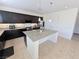 Bright, modern kitchen with stainless appliances, granite counters, and a kitchen island at 8665 Jerlyn St, Las Vegas, NV 89113