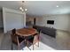Bright living and dining area with carpet, neutral paint, and recessed lighting at 8665 Jerlyn St, Las Vegas, NV 89113