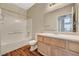 A bright bathroom with a vanity and a combined shower and tub at 9050 W Warm Springs Rd # 2051, Las Vegas, NV 89148