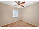 Neutral-toned bedroom features carpet, a ceiling fan with lights, and a window with blinds at 9050 W Warm Springs Rd # 2051, Las Vegas, NV 89148