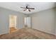 Neutral-toned bedroom features carpet and two doorways - one to a bathroom and the other to a closet at 9050 W Warm Springs Rd # 2051, Las Vegas, NV 89148