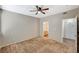 Neutral-toned bedroom featuring carpet and two doorways - one to a bathroom and the other to a closet at 9050 W Warm Springs Rd # 2051, Las Vegas, NV 89148