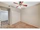 Neutral-toned bedroom featuring carpet, a ceiling fan with lights, and closet at 9050 W Warm Springs Rd # 2051, Las Vegas, NV 89148