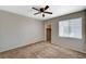 Neutral-toned bedroom featuring carpet, a ceiling fan, and a window with blinds at 9050 W Warm Springs Rd # 2051, Las Vegas, NV 89148