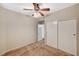 Neutral-toned bedroom featuring carpet, a ceiling fan with lights, and a closet at 9050 W Warm Springs Rd # 2051, Las Vegas, NV 89148