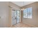 Cozy dining area with a sliding glass door to a balcony and natural light at 9050 W Warm Springs Rd # 2051, Las Vegas, NV 89148