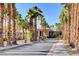 Gated entrance surrounded by tall palm trees welcomes residents to their community at 9050 W Warm Springs Rd # 2051, Las Vegas, NV 89148