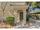 Inviting front entrance with an arched entryway and well-kept surroundings at 9050 W Warm Springs Rd # 2051, Las Vegas, NV 89148