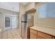 Kitchen area with stainless steel refrigerator and sliding door to the balcony at 9050 W Warm Springs Rd # 2051, Las Vegas, NV 89148