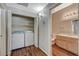 A laundry closet with washer and dryer units, attached to a bathroom at 9050 W Warm Springs Rd # 2051, Las Vegas, NV 89148