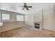 Comfortable living room featuring a cozy fireplace and neutral color scheme at 9050 W Warm Springs Rd # 2051, Las Vegas, NV 89148