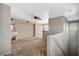 Open living area with neutral paint, a ceiling fan, and access to a balcony at 9050 W Warm Springs Rd # 2051, Las Vegas, NV 89148