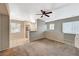 Bright living space with a ceiling fan, open to the dining area and kitchen at 9050 W Warm Springs Rd # 2051, Las Vegas, NV 89148