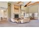 Clubhouse lobby with stone fireplace, beamed ceilings, and seating areas at 9050 W Warm Springs Rd # 2051, Las Vegas, NV 89148