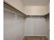 A walk-in closet with ample shelving and hanging space for organized storage at 9050 W Warm Springs Rd # 2051, Las Vegas, NV 89148