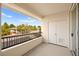 A covered balcony looks out to neighborhood buildings and desert vegetation at 913 Duckhorn Ct # 204, Las Vegas, NV 89144