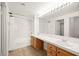 Well-lit bathroom featuring double sinks and shower-tub combination at 913 Duckhorn Ct # 204, Las Vegas, NV 89144