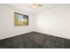 Bright bedroom with window and plush gray carpet at 913 Duckhorn Ct # 204, Las Vegas, NV 89144