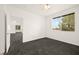 Comfortable bedroom featuring gray carpeting and natural light at 913 Duckhorn Ct # 204, Las Vegas, NV 89144
