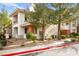 Well-maintained condo with landscaped grounds, trees and visible parking at 913 Duckhorn Ct # 204, Las Vegas, NV 89144