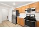Well-lit kitchen with stainless steel appliances and sleek wood cabinets at 913 Duckhorn Ct # 204, Las Vegas, NV 89144