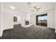 Spacious living room with fireplace and sliding door access to the outdoor balcony at 913 Duckhorn Ct # 204, Las Vegas, NV 89144