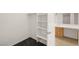 Bright walk-in closet featuring custom shelving and convenient access to the primary bathroom vanity at 913 Duckhorn Ct # 204, Las Vegas, NV 89144