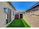 Narrow backyard with artificial turf and a view of the mountains at 924 Allister Fields Ln, Las Vegas, NV 89138