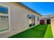 Narrow backyard with low maintenance turf and views of the mountains at 924 Allister Fields Ln, Las Vegas, NV 89138