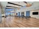 Spacious event space with wood floors, high ceilings, exposed beams, abundant natural light, and comfortable seating at 924 Allister Fields Ln, Las Vegas, NV 89138